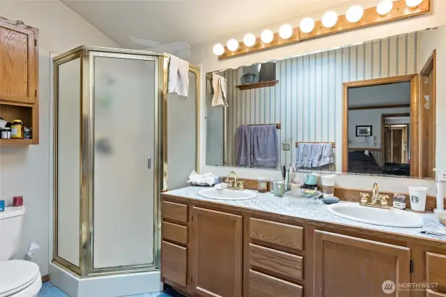 Primary bath with double sinks and walk-in closet