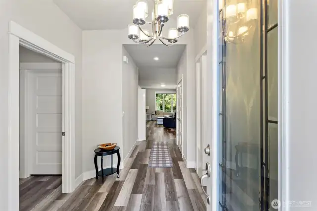 Spacious entry with high ceilings and stunning engineered hardwood floors.