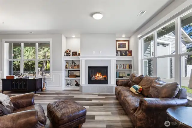 The first living space just off the main entrance with custom built ins, gas fireplace, and loads of natural light.