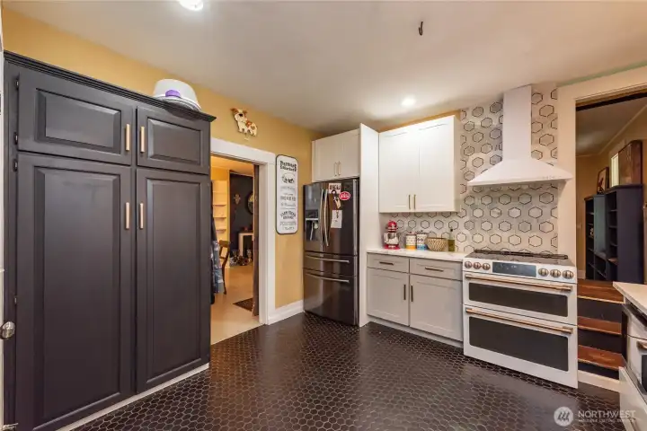 With modern cabinetry, full height backsplash and high end appliances, this kitchen will surely be your favorite room in the house!