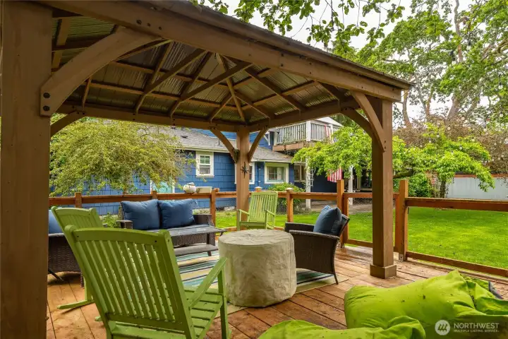 Covered patio perfect for entertaining. Complete the space with an outdoor projector for more fun!