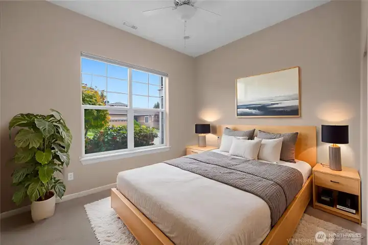 Bright second bedroom with a large closet and plenty of natural light.