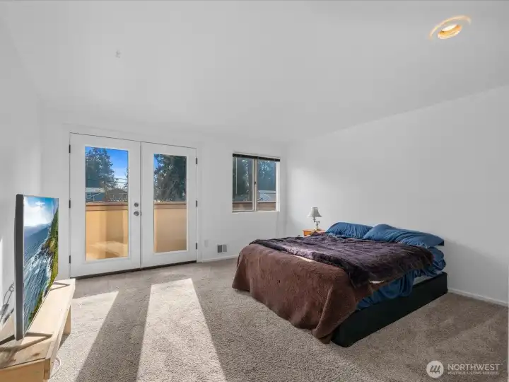 Very spacious primary bedroom with French doors lead to private balcony to take in territorial & sunset views!