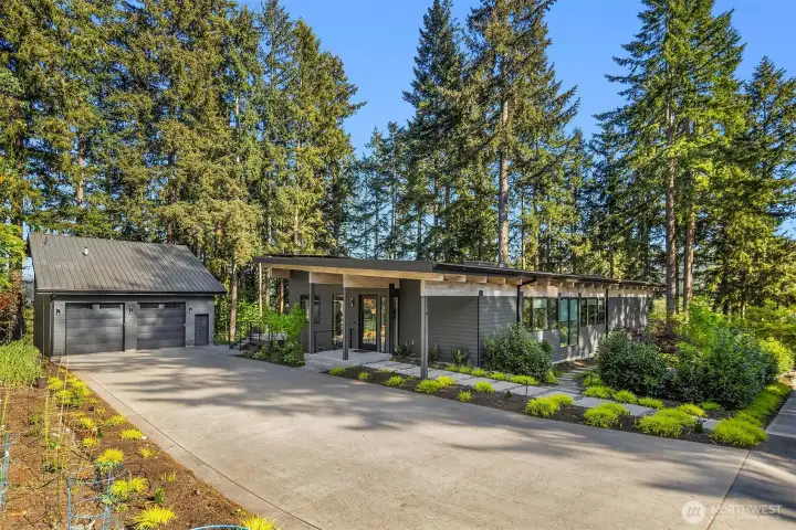 Custom like new build with extensive landscaping, private drive, out door living and tandem garage parking for 5+ cars with lift
