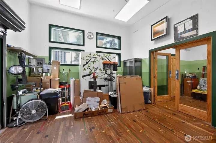 Custom shop with tons of natural light and hardwoods.
