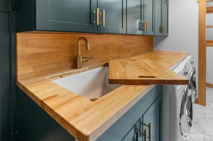 Laundry with butcher block counter and large sink