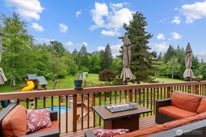Oversize deck looking over 5 acre yard