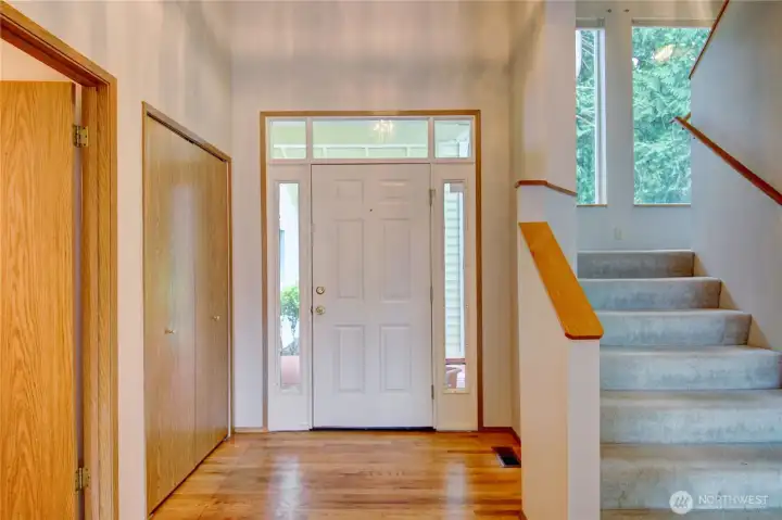 Welcoming entry with coat closet and 1/2 bath to the left of photo Welcoming entry with coat closet and 1/2 bath to the left of photo