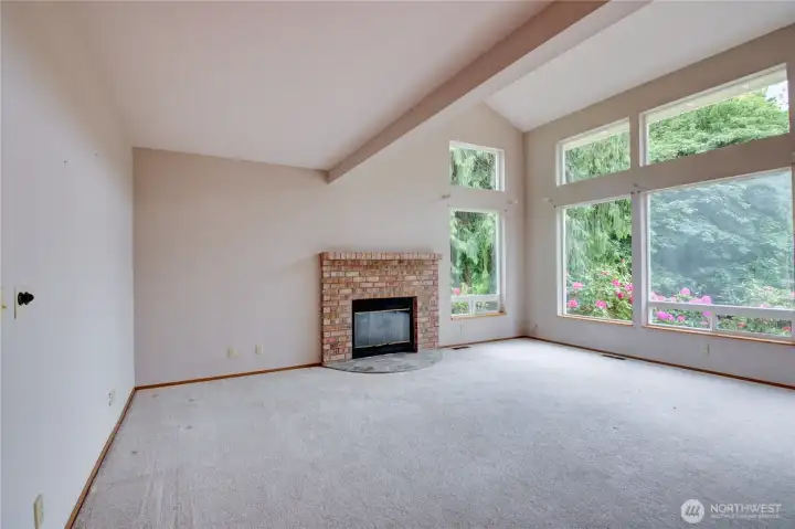 Huge livingroom with picture windows and wood burning fireplace Huge livingroom with picture windows and wood burning fireplace