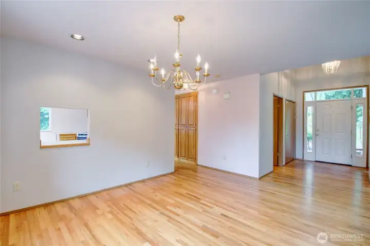 Main dining room - by the front door is a 1/2 bath and coat closet and the doors in hallway are a massive pantry Main dining room - by the front door is a 1/2 bath and coat closet and the doors in hallway are a massive pantry