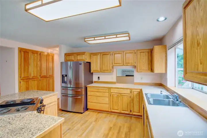 Kitchen is very large with and abundance of cabinetry and countertops Kitchen is very large with and abundance of cabinetry and countertops