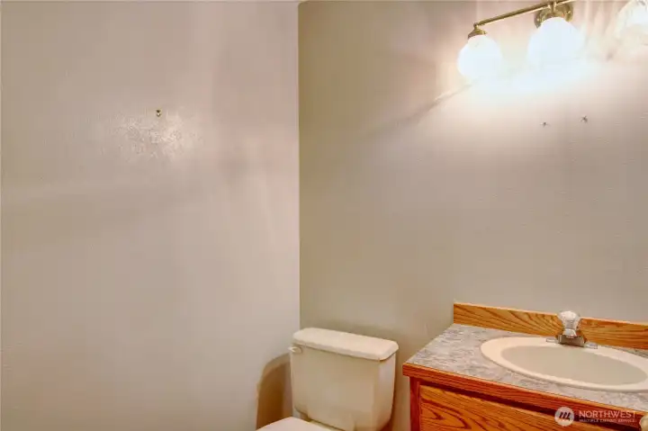 Main level 1/2 Bath #1 located off the front door entry Main level 1/2 Bath #1 located off the front door entry