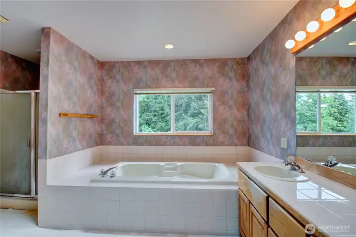 Primary ensuite with walk-in shower and jetted soaker tub Primary ensuite with walk-in shower and jetted soaker tub