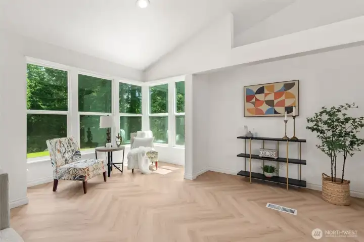 This bright reading nook off the living room is the perfect place to cozy up and relax This bright reading nook off the living room is the perfect place to cozy up and relax