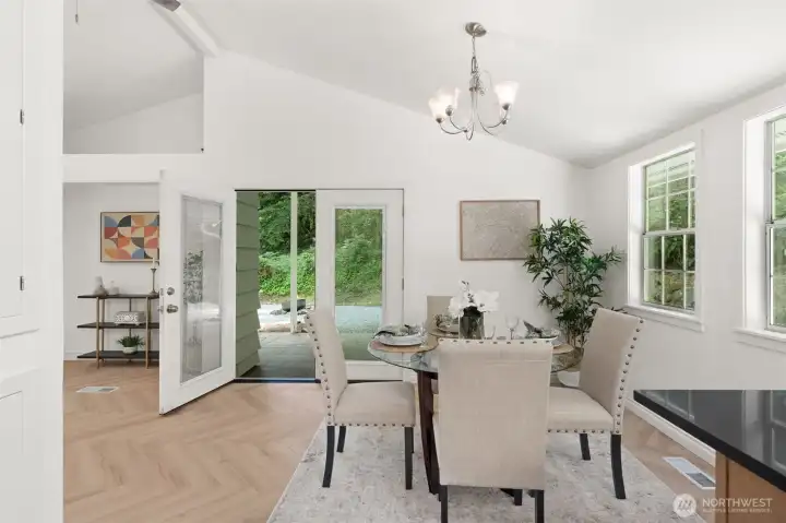 Dining opens to covered patio with views of nature Dining opens to covered patio with views of nature