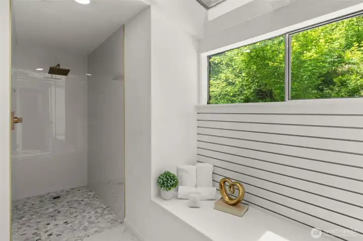 Remodeled primary bath with custom-tiled walk-in shower Remodeled primary bath with custom-tiled walk-in shower