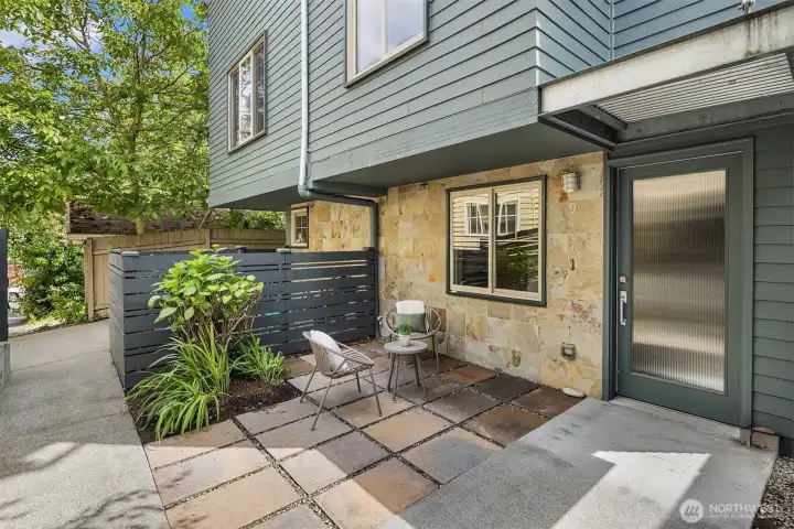 Privately tucked behind a fenced courtyard, the welcoming entry creates a peaceful arrival just moments from Green Lake, Phinney Ridge, and neighborhood favorites.