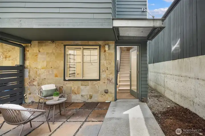 Thoughtfully designed for low-maintenance outdoor living, the fenced patio provides a peaceful extension of the home in the center of the city.