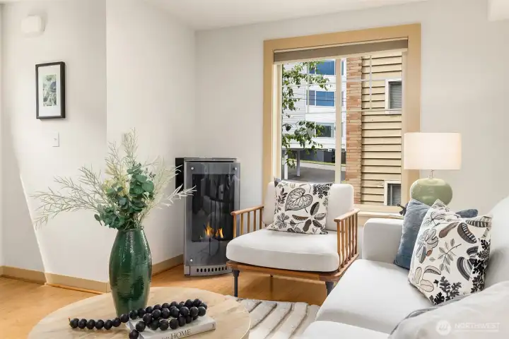 The contemporary gas fireplace creates a warm focal point, making this an inviting place to relax after a day at Green Lake.