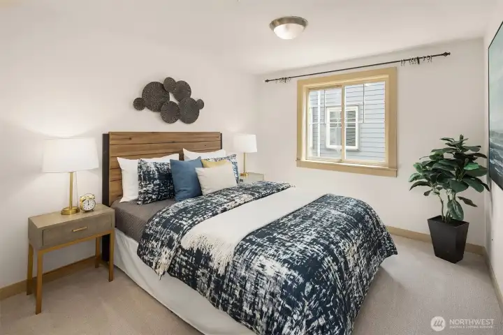 Bright and comfortable, this secondary bedroom offers a welcoming space for guests, family members, or long-term visitors.