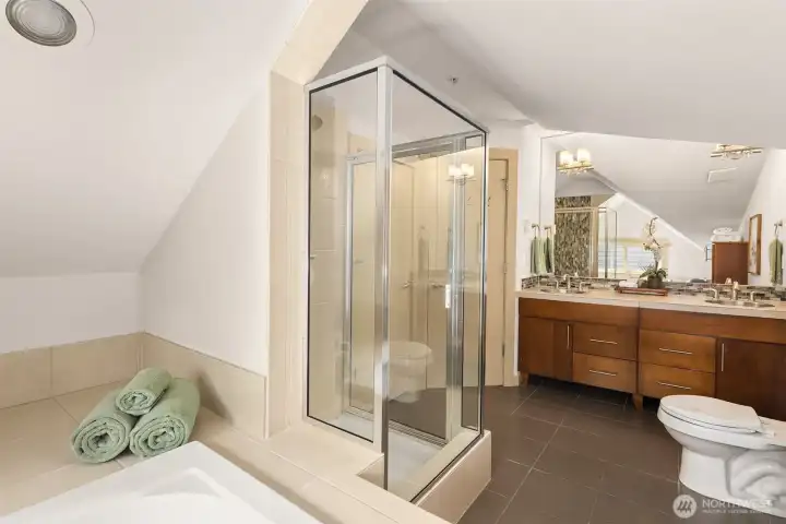 Unwind after a day at Green Lake in the spa-inspired five-piece bath, complete with soaking tub, separate shower, and generous storage.