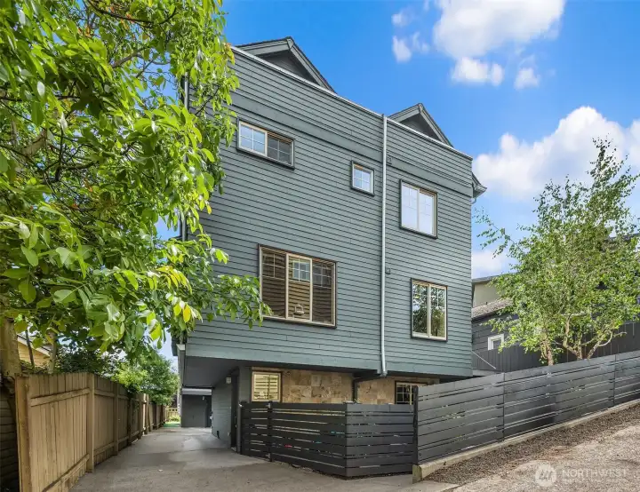 Freshly updated with a new roof, full exterior paint, and new fencing in 2026, this stylish Green Lake townhome offers turnkey living with the rare advantage of no HOA dues.
