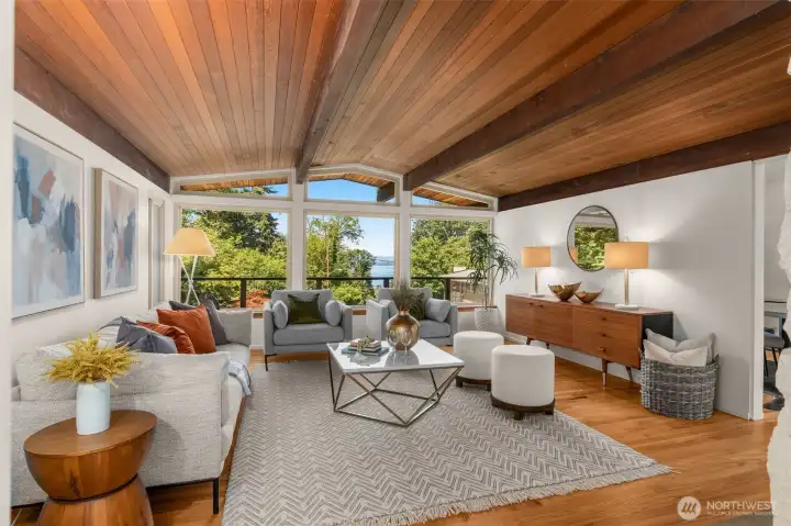 Floor to ceilings window in formal living room showcases the stunning PugetSound view Floor to ceilings window in formal living room showcases the stunning PugetSound view