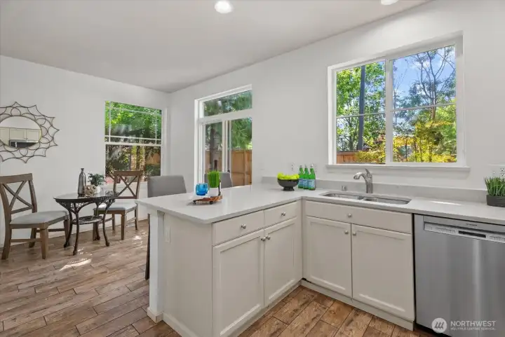 Bright kitchen with comfortable eating area Bright kitchen with comfortable eating area