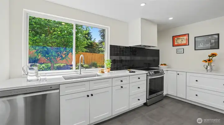 Kitchen has been updated in 2025, featuring porcelain tile flooring and quartz countertops.