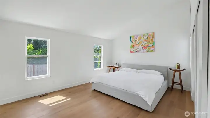 Retreat the spacious primary bedroom, with an en-suite 3/4 bath.