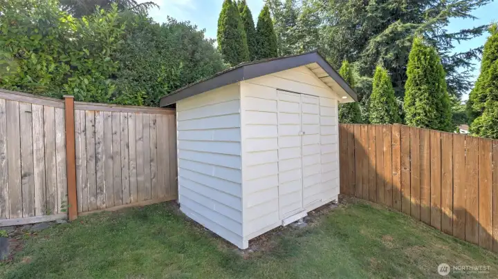 The shed provides extra storage for lawn equipment, gardening tools, or toys!