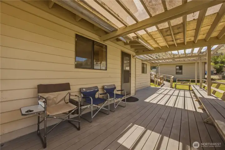 Side Porch off Kitchen with Access Ramp to Garage.