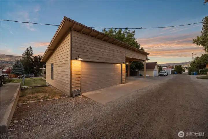Alley Access 2 Car Garage, 2 Car Carport & 3 uncovered spaces.