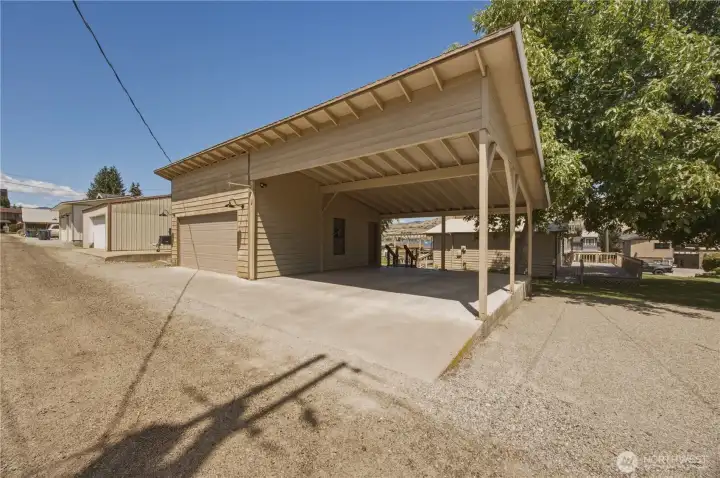 Alley Access 2 Car Garage, 2 Car Carport & 3 uncovered spaces.