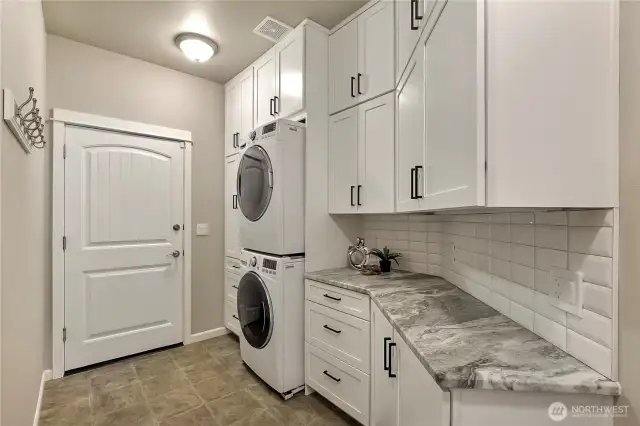 Custom cabinets recently installed into the laundry room for storage.