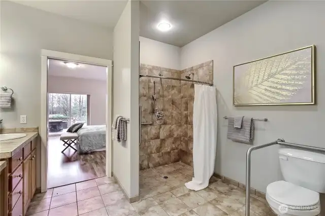 Accessible tile shower with double shower heads.