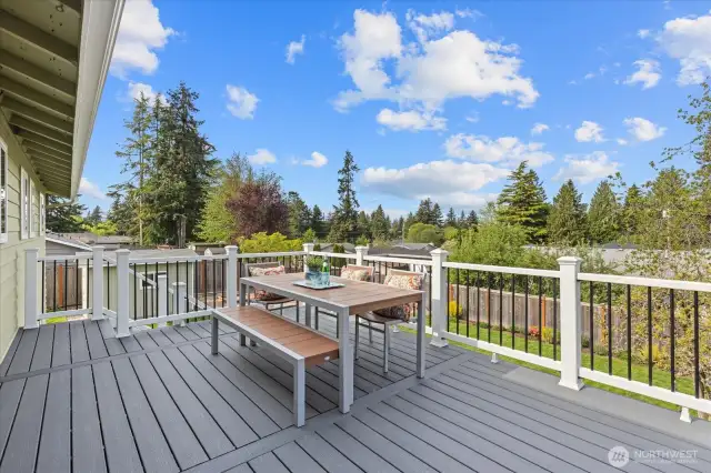 Entertainment-sized new Trex deck—perfect for soaking up the sun, al fresco dining, or keeping an eye on backyard play.
