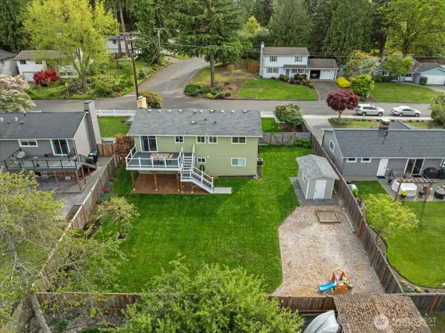 Large sunny, flat back yard ready for play, garden and all of your toys.