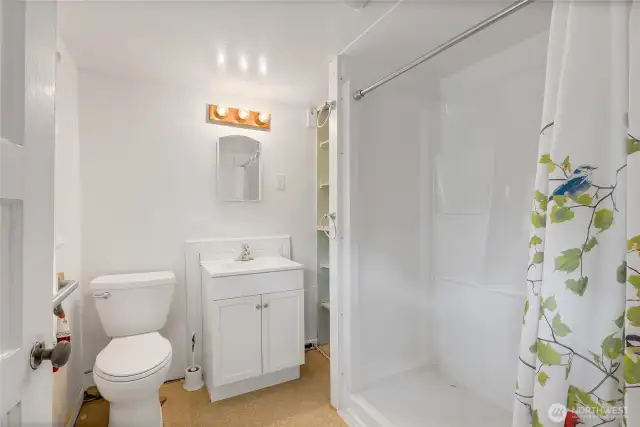 3/4 bath located between 1st and second floors, up a few steps from main floor.