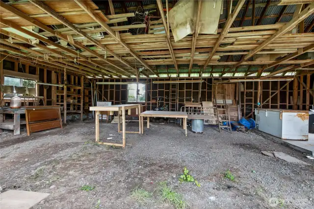 3 car garage/carport - doors were never installed.  Freezers are included.