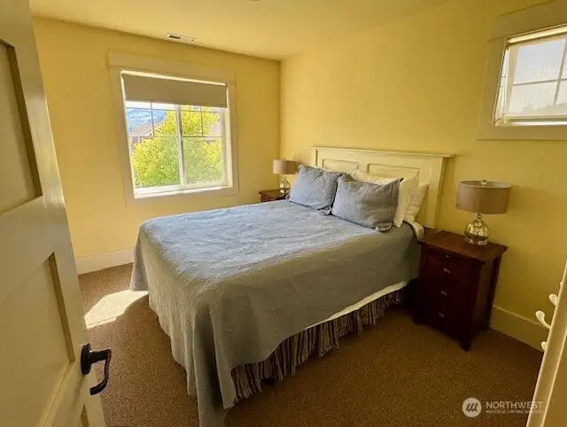 Roomy Guest bedroom offers views of the Lake