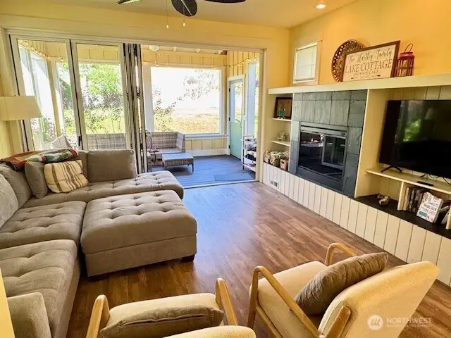 Great Room offers electric fireplace and custom built-ins.