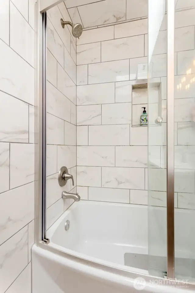 New tile, fixtures & shower door here too!