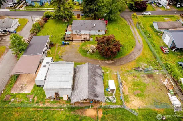 Notice the shop & carport to the left, barn & outbuilding (potential DADU) in the foreground. 2 bedroom, 2 bathroom house is at the top.