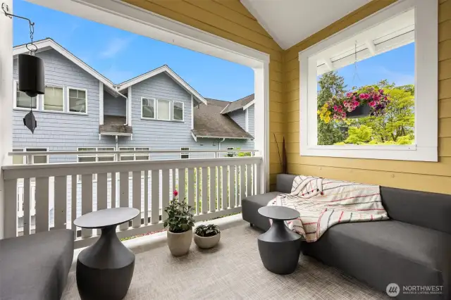 The balcony is protected by a vaulted bead bead board ceiling and has east and west views.