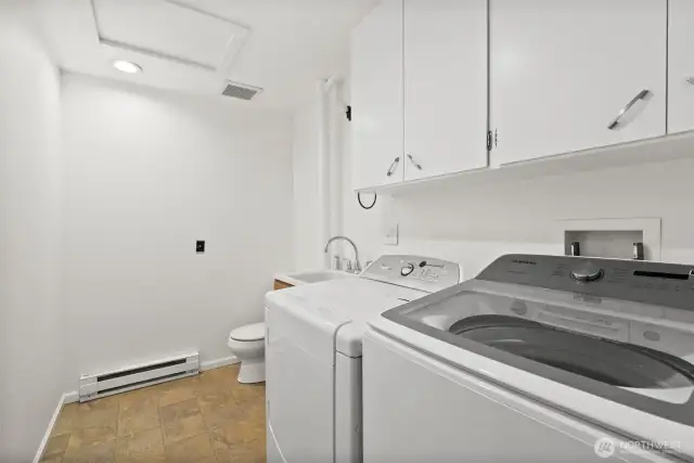 Laundry room with half bathroom