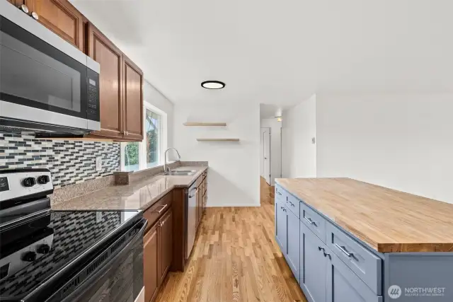 Butcher Block Floating Shelves enhance the updated kitchen!
