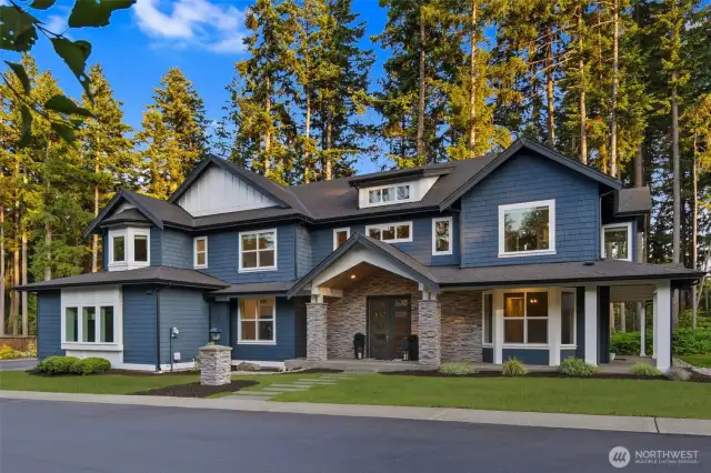 One of a kind custom built home with wrap around covered porch.