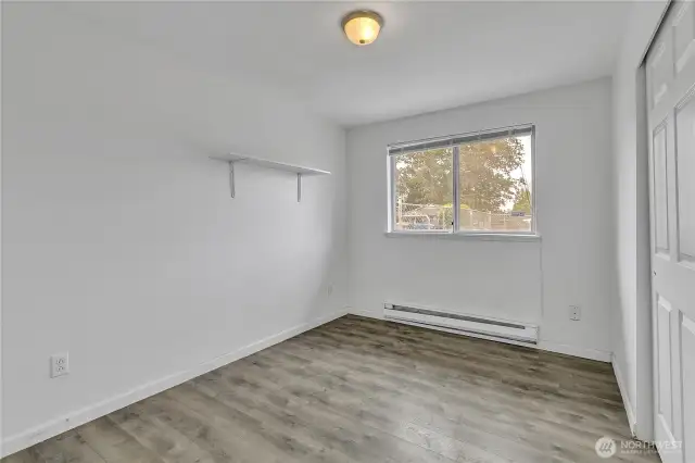 Bedroom, with upgraded flooring.