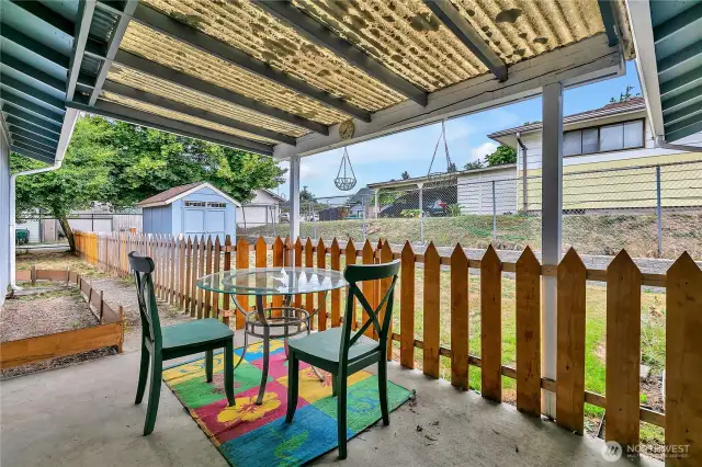 Covered Patio off of Garage, fencing for pets.